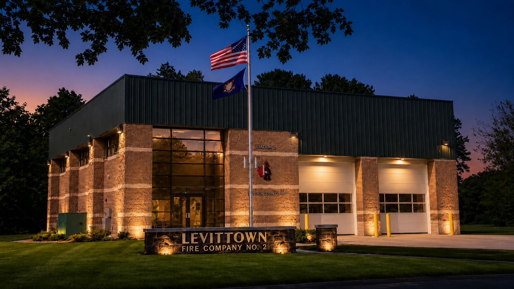 Levittown Fire Company No. 2 station illuminated at dusk
